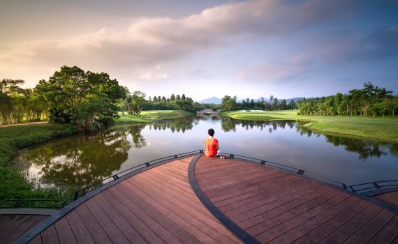 person sitting on dock