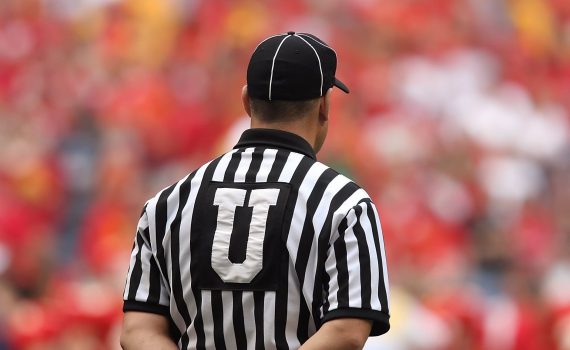 selective focus photography of male umpire