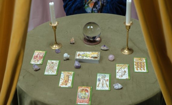 tarot cards and a crystal ball on the table