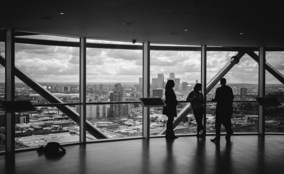 people standing inside city building